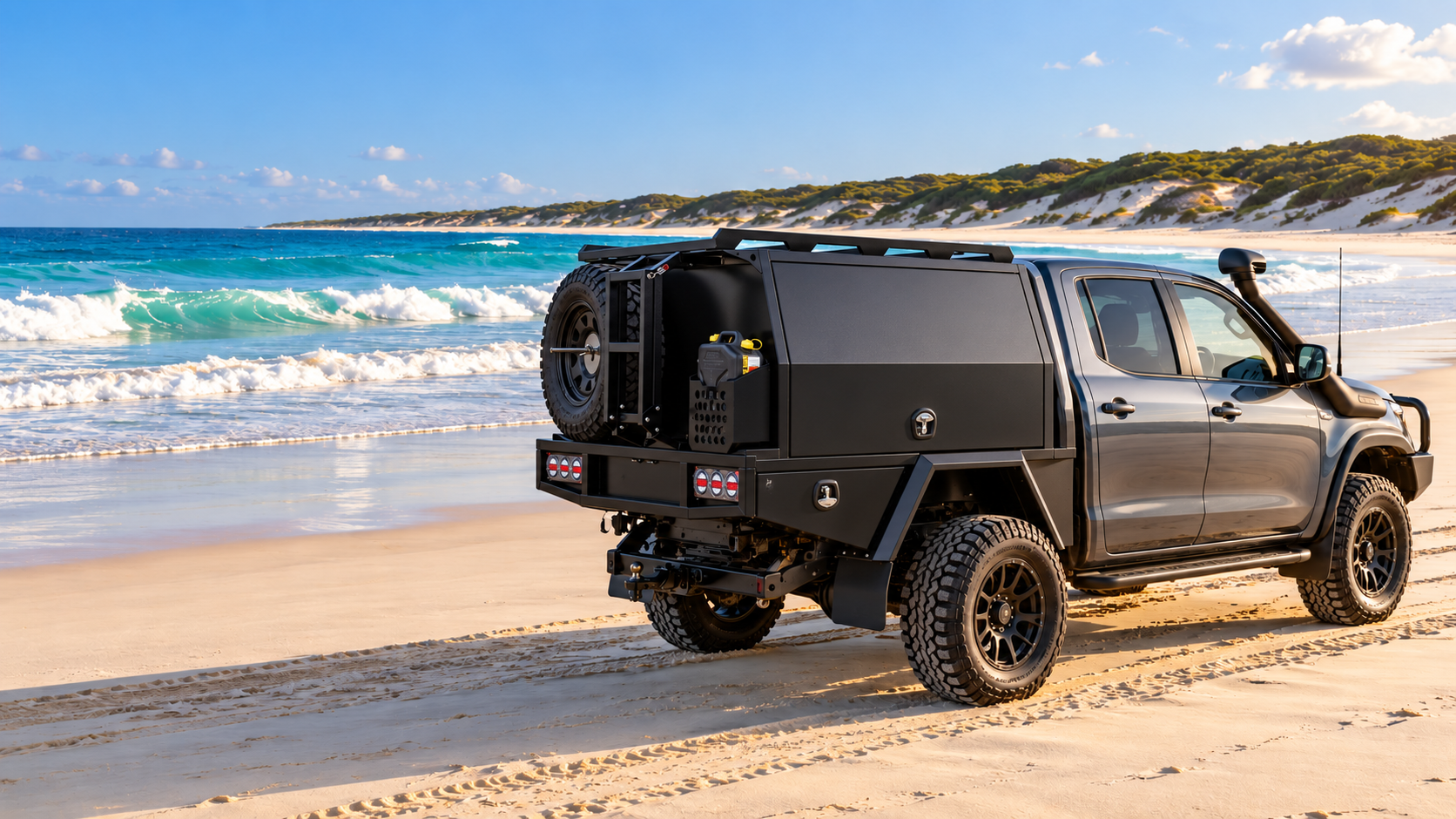 Illustrative grey 4WD ute with custom black aluminium service body on a beach inspired by K'gari (Fraser Island), Australia
